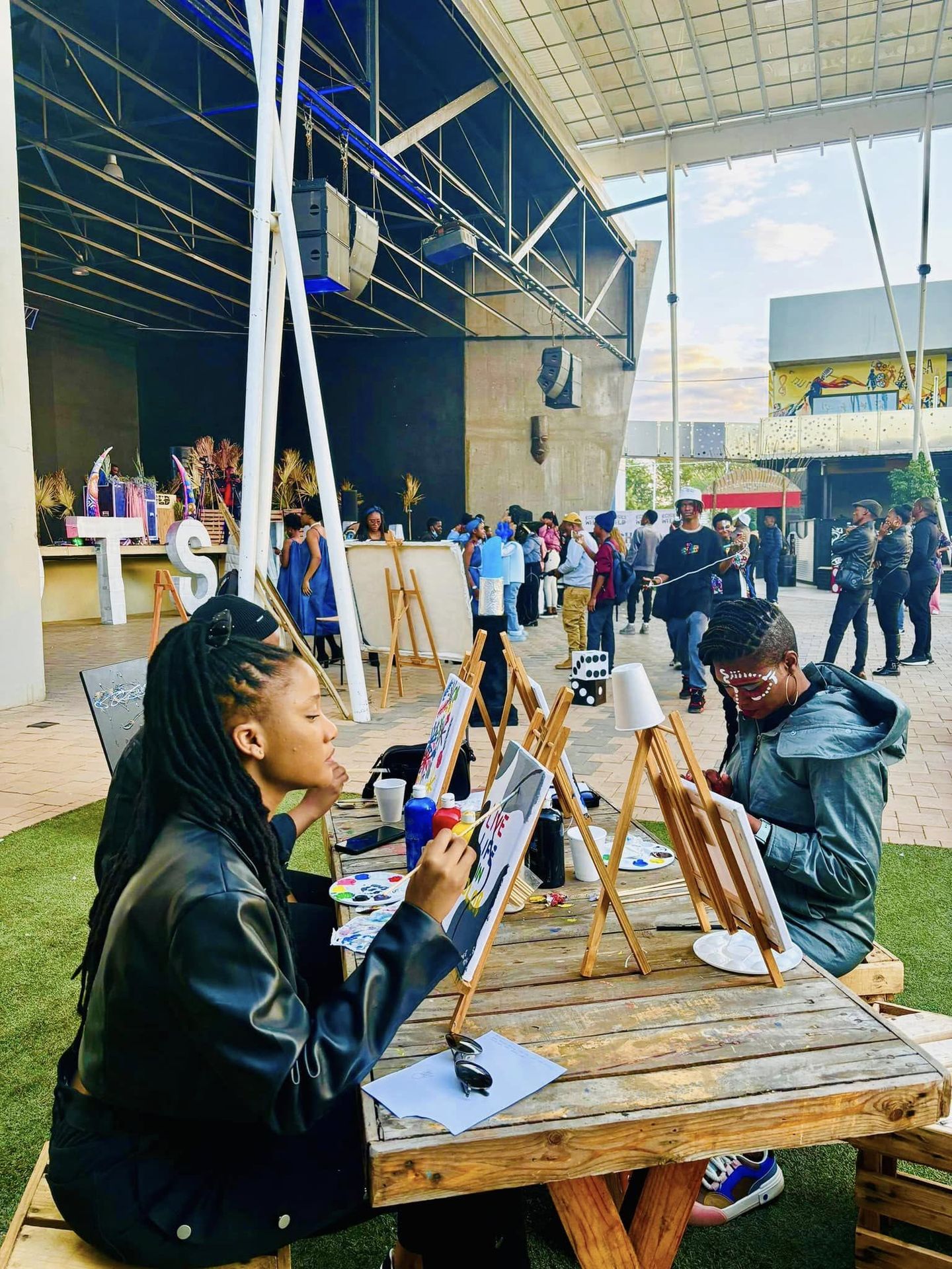 Guests painting canvases at an Echoes event